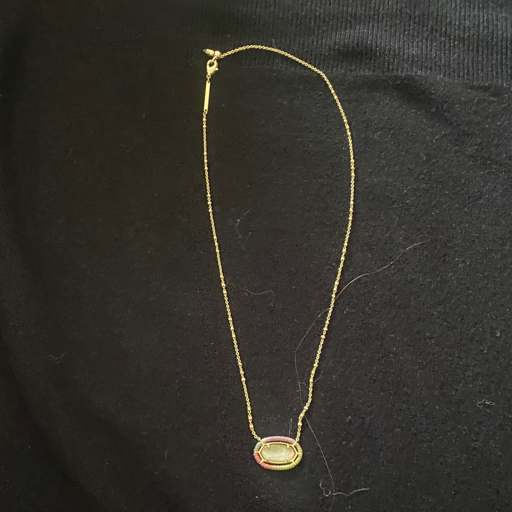 Elegant Gold Necklace with Oval Pendant. With rainbow metallic trim